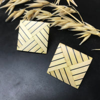 Quadrati origami color paglia e nero